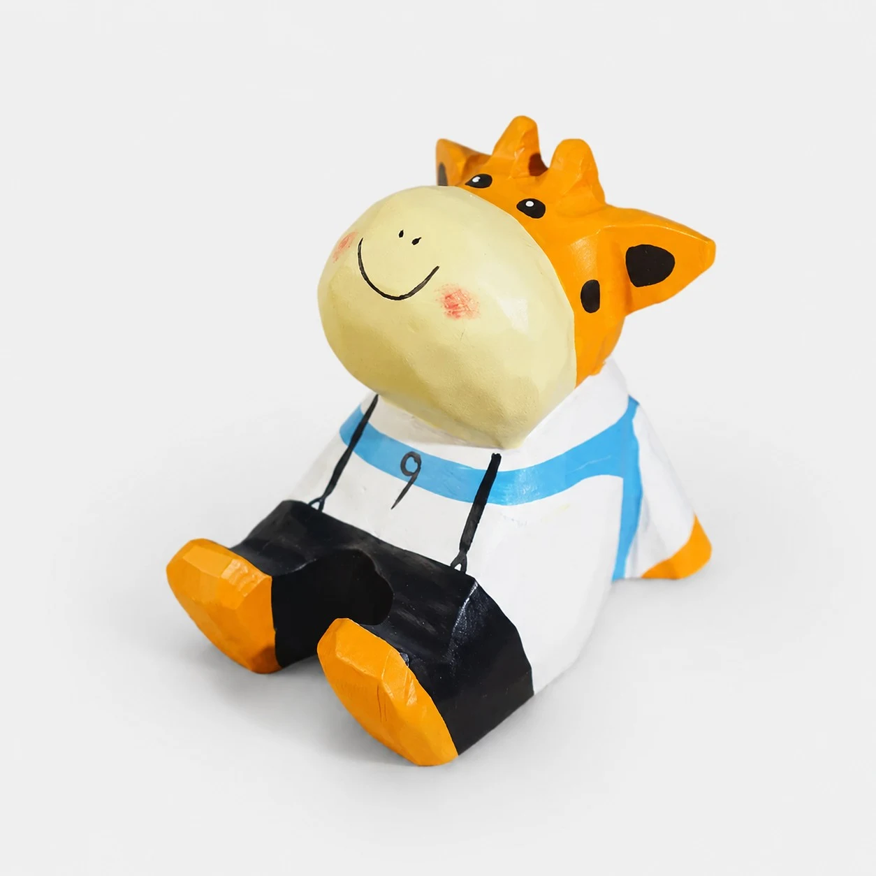 Support de téléphone en bois sculpté à la main en forme de petite vache