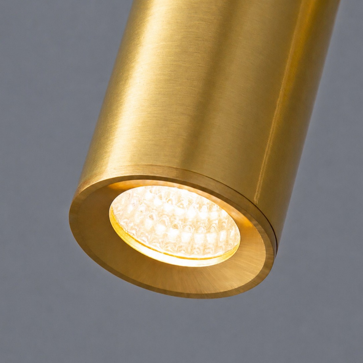 Illuminated brass spotlight head close view