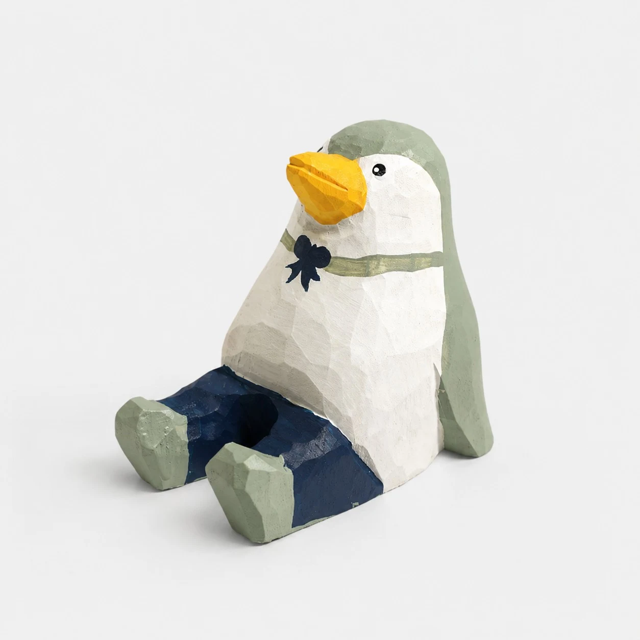 Support de téléphone en bois sculpté à la main en forme de pingouin